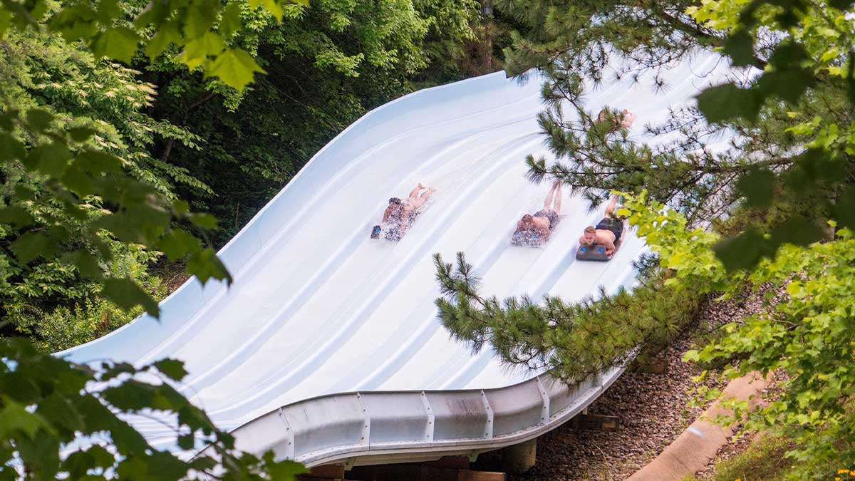 people sliding down Nitro Racer at Water Country USA in Williamsburg, Virginia, USA